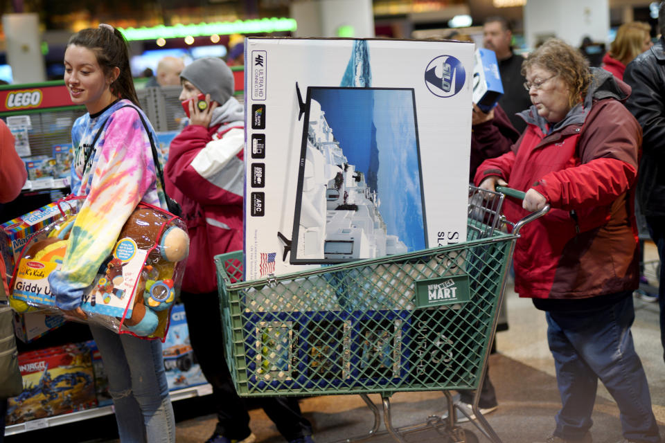 Black Friday shoppers wait in line to check out at the Nebraska Furniture Mart store in Omaha, Neb., Friday, Nov. 23, 2018. (AP Photo/Nati Harnik)