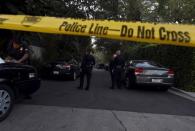 A yellow police tape and a police cruiser block off the street leading to the house of Andrew Getty, the grandson of Getty oil founder J. Paul Getty, in the Hollywood Hills section of Los Angeles, California March 31, 2015. REUTERS/Kevork Djansezian