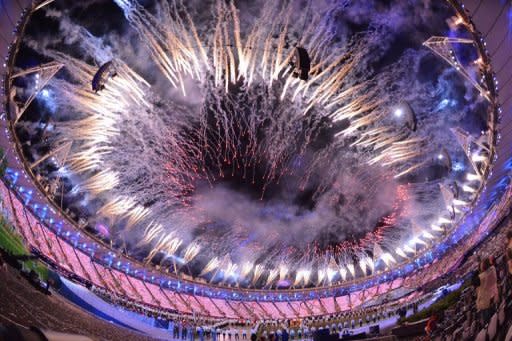 Fireworks burst over the Olympic Stadium during the opening ceremony of the London 2012 Olympic Games, on July 27. Seven young athletes lit the cauldron at the Olympics at the finale of a humour-filled opening ceremony watched by more than one billion TV viewers