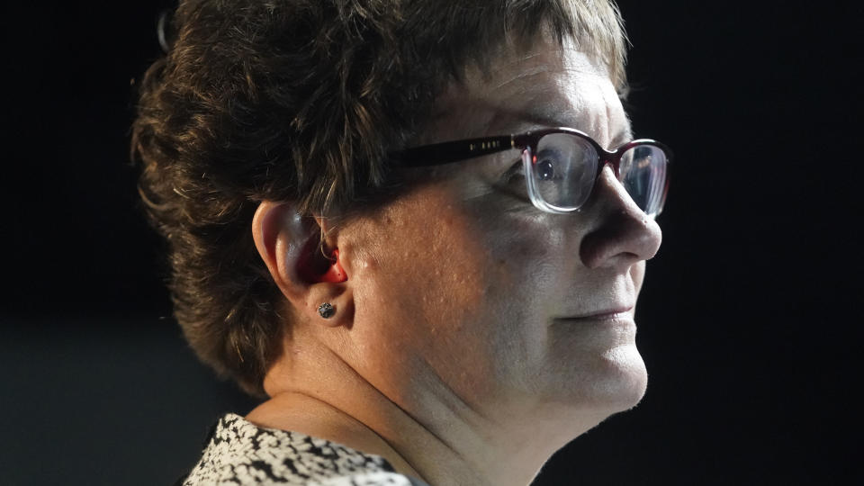 Chelle Wyatt wears her hearing aid Friday, April 15, 2022, in Salt Lake City. People with hearing loss have adopted technology to navigate the world, especially as hearing aids are expensive and inaccessible to many. (AP Photo/Rick Bowmer)