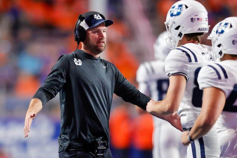 Utah State head coach Nate Dreiling greets his offense after a touchdown against Boise State in the second half of an NCAA college football game, Saturday, Oct. 5, 2024, in Boise, Idaho. Boise State won 62-30. (AP Photo/Steve Conner) | Steve Conner