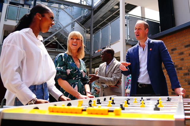 <p>VICTORIA JONES/POOL/AFP via Getty Images</p> Prince William enjoys a game with residents of the new Centrepoint development