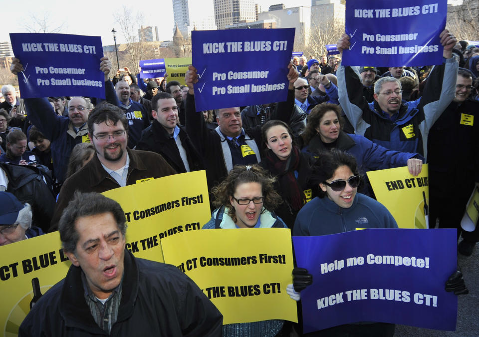 People rally outside the Capitol in support of retail alcohol sales on Sundays in Hartford, Conn., Tuesday, Feb. 28, 2012. The lobbyist for the Connecticut Package Stores Association says his group is now supporting retail sales of alcohol on Sundays. But many liquor store owners have opposed efforts for years, saying it would cost too much money in staffing. (AP Photo/Jessica Hill)