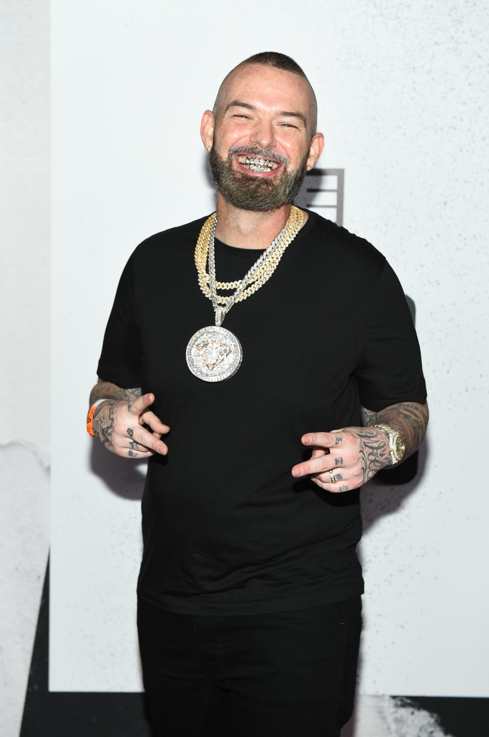 Paul Wall Wearing Black Shirt And Jewelry 