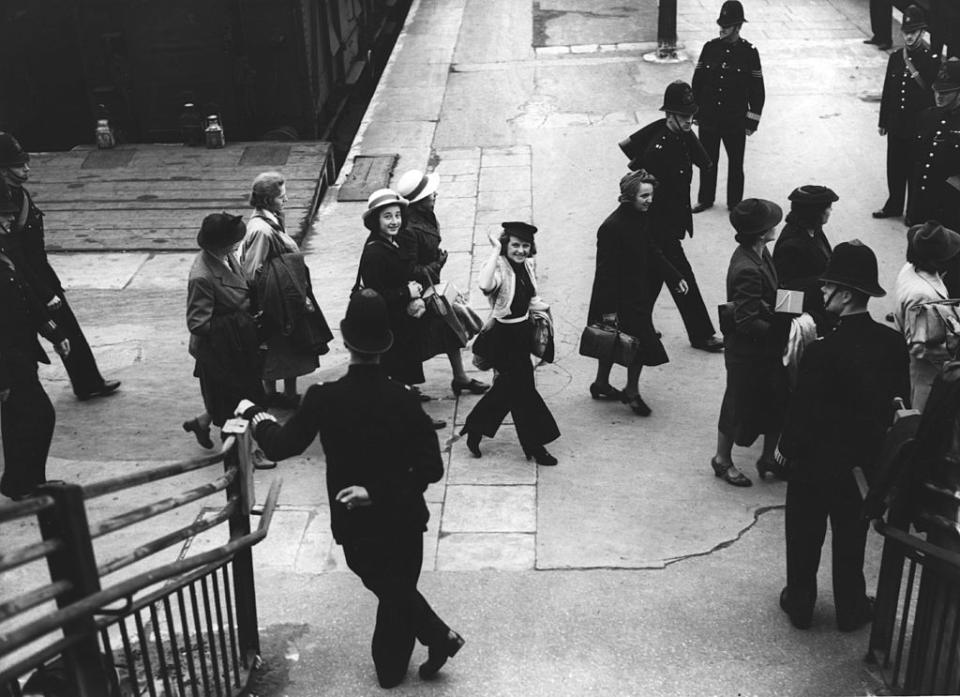 29th May 1940: Germans and Austrians leaving mainland Britain for an interment camp on the Isle of Man, arriving at the station escorted by police.<span class="copyright">Fox Photos-Getty Images</span>