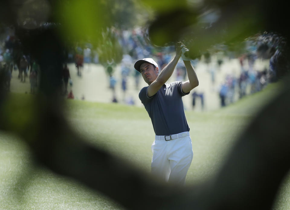 Ross Fisher of England, hits a shot on the first hole during the final round of the Masters golf tournament Sunday, April 9, 2017, in Augusta, Ga. (AP Photo/Chris Carlson)