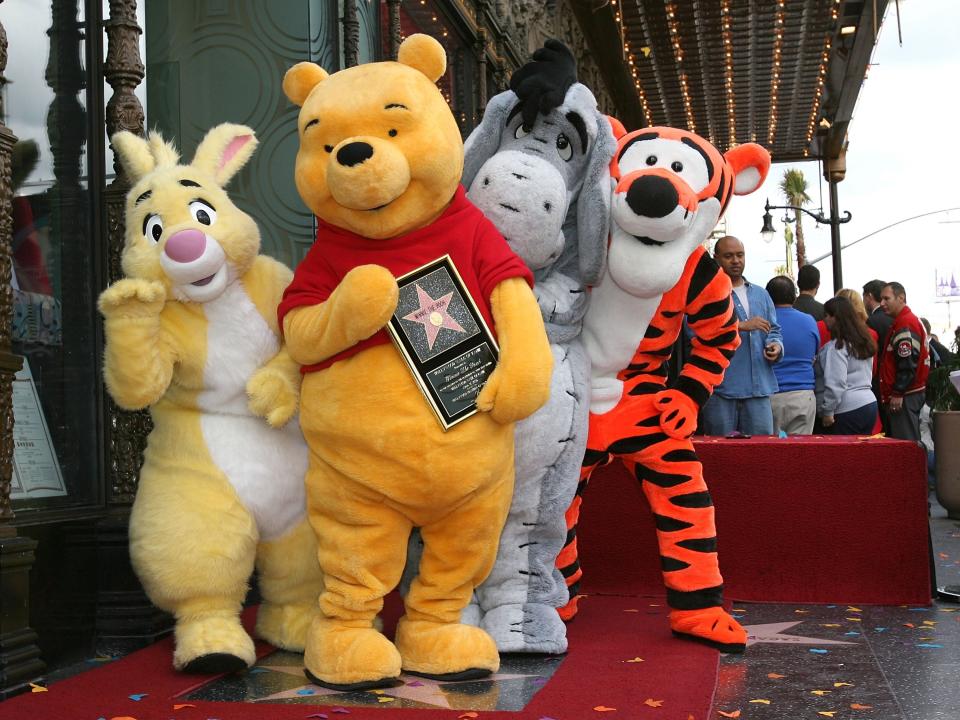 Winnie the Pooh and Tigger as life-size costumes.