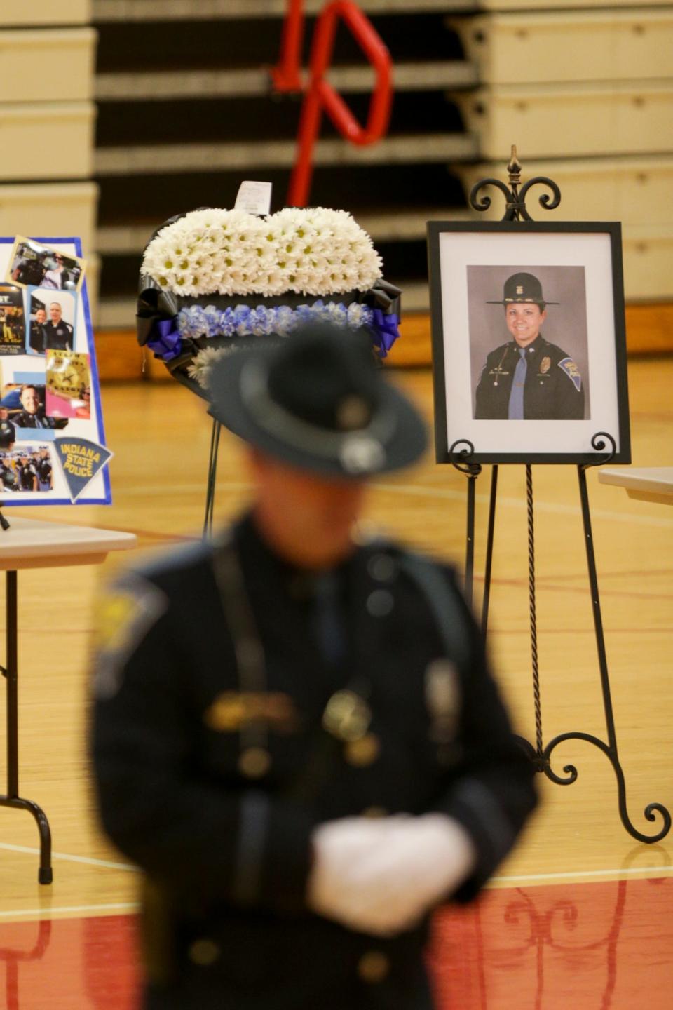 Community members and first responders pay their respects during calling hours for Indiana State Police Sgt. Stephanie Thompson and Mya Thompson, Thursday, Feb. 24, 2022 in Monticello. Sgt. Thompson and Mya, 17, died in an early-morning house fire in Monticello on Feb. 17.