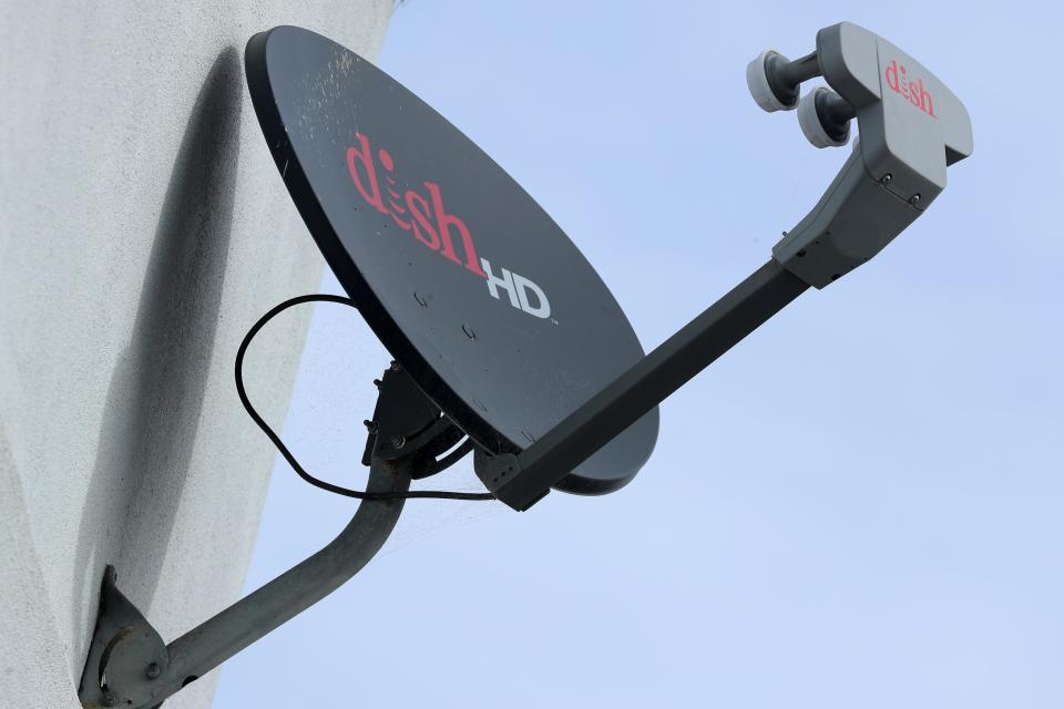 A Dish Network satellite dish is shown on a residential home in Encinitas, California, U.S., November 8, 2017. REUTERS/Mike Blake