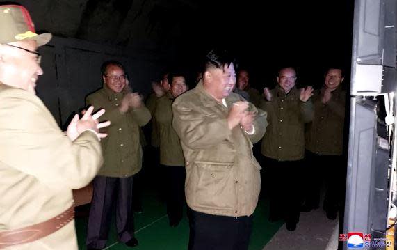 An image released by North Korea's state-run Korea Central News Agency (KCNA) on October 13, 2022 shows what the network said was leader Kim Jong Un observing the test firing of long-range cruise missiles on the previous day. / Credit: Reuters/KCNA