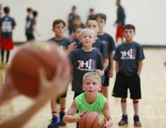 Mason Burch shoots a basket during Jordan Hulls' 2017 basketball camp at Bloomington South.