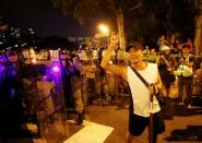 Protest at Yuen Long MTR station, the scene of an attack by suspected triad gang members a month ago