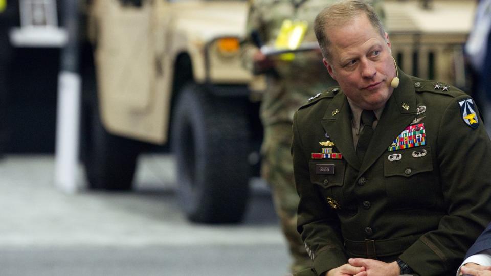 Maj. Gen. Walter Rugen, the director of the Future Vertical Lift Cross-Functional Team, listens to a speech Oct. 12, 2022, at the Association of the U.S. Army annual conference in Washington, D.C. (Colin Demarest/C4ISRNET)