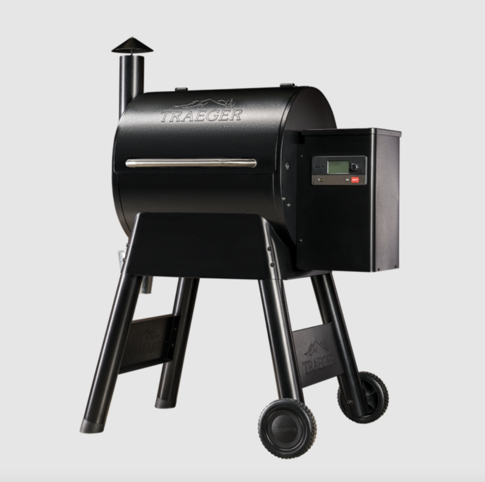 black Traeger Pro 575 Grill with smokestack and wheels