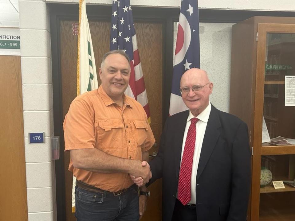 The Clear Fork Board of Education has named John Thomas, right, as interim superintendent. At left is school board president Brian Johnson.