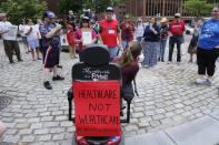 <p>Kingsley Floyd, center, a Waynflete graduate who was arrested at a health care protest in front of Senate Majority Leader Mitch McConnell’s office last week, attends a rally for health care at Lobsterman’s Park in Portland, Maine on Wednesday, June 28, 2017. (Photo: Derek Davis/Portland Press Herald via Getty Images) </p>