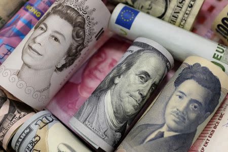 Bank notes of Euro, Hong Kong dollar, U.S. dollar, Japanese yen, GB pound and Chinese yuan are seen in this picture illustration, January 21, 2016. REUTERS/Jason Lee/Illustration/File Photo