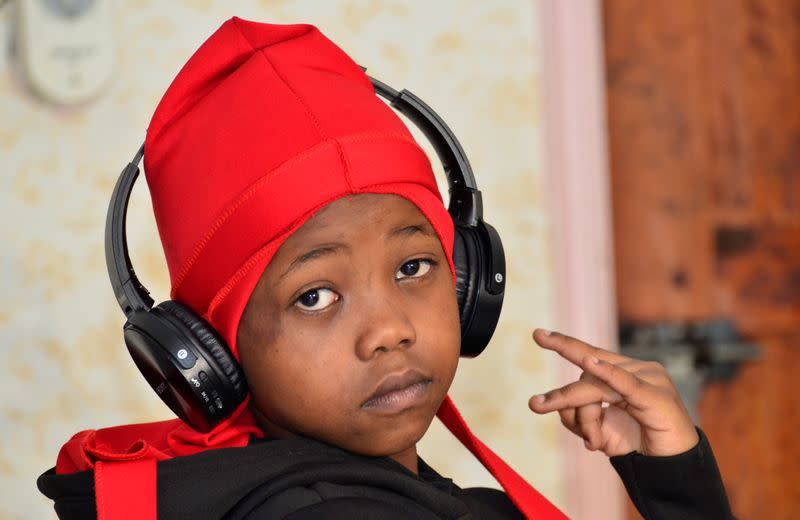 Ugandan eight-year-old rapper "Fresh Kid", whose real name is Patrick Ssenyonjo, poses for a picture during an interview with Reuters in Bukoto, a suburb of Kampala