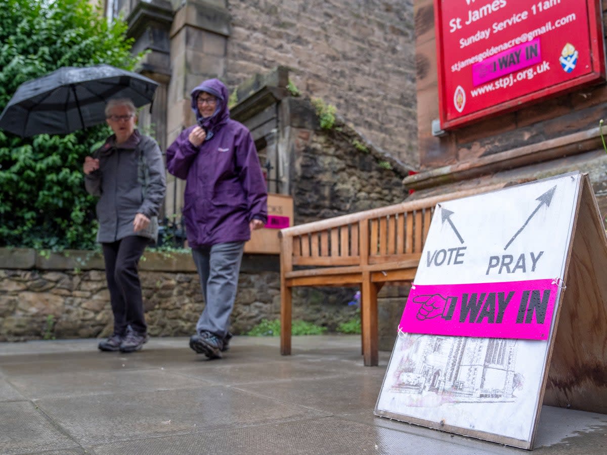 Voters in many areas faced cold and drizzle (Jane Barlow/PA Wire)