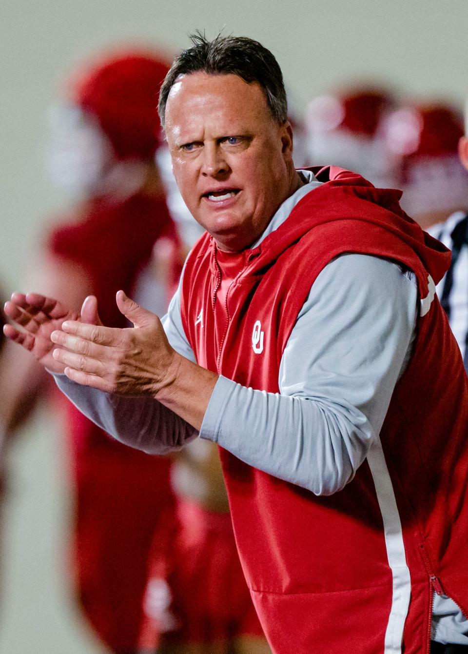 OU assistant head coach Cale Gundy works with the team during practice on March 22 in Norman.