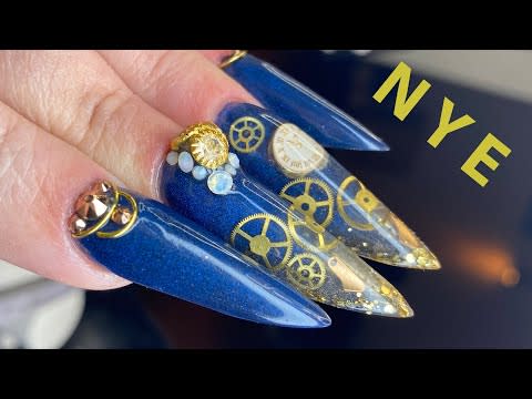 <p>Get in gear for the New Year with nails that combine a Russian Almond shape with clock cogs and faces. This helpful tutorial will even take you through the process building the false nails.</p><p><a class="link " href="https://www.amazon.com/XINGZI-200-300PCS-Ultra-thin-Decorations-Accessories/dp/B07Z4MY36L/ref=sr_1_4?tag=syn-yahoo-20&ascsubtag=%5Bartid%7C10050.g.34839847%5Bsrc%7Cyahoo-us" rel="nofollow noopener" target="_blank" data-ylk="slk:SHOP CLOCK NAIL ACCESSORIES">SHOP CLOCK NAIL ACCESSORIES</a></p><p><a href="https://www.youtube.com/watch?v=NnFwFxAsdPs" rel="nofollow noopener" target="_blank" data-ylk="slk:See the original post on Youtube" class="link ">See the original post on Youtube</a></p>