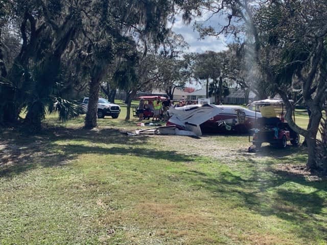 Two people escaped serious injuries on Thursday when this Piper Malibu plane crashed into a tree while taking off at the Spruce Creek Fly-In in Port Orange.