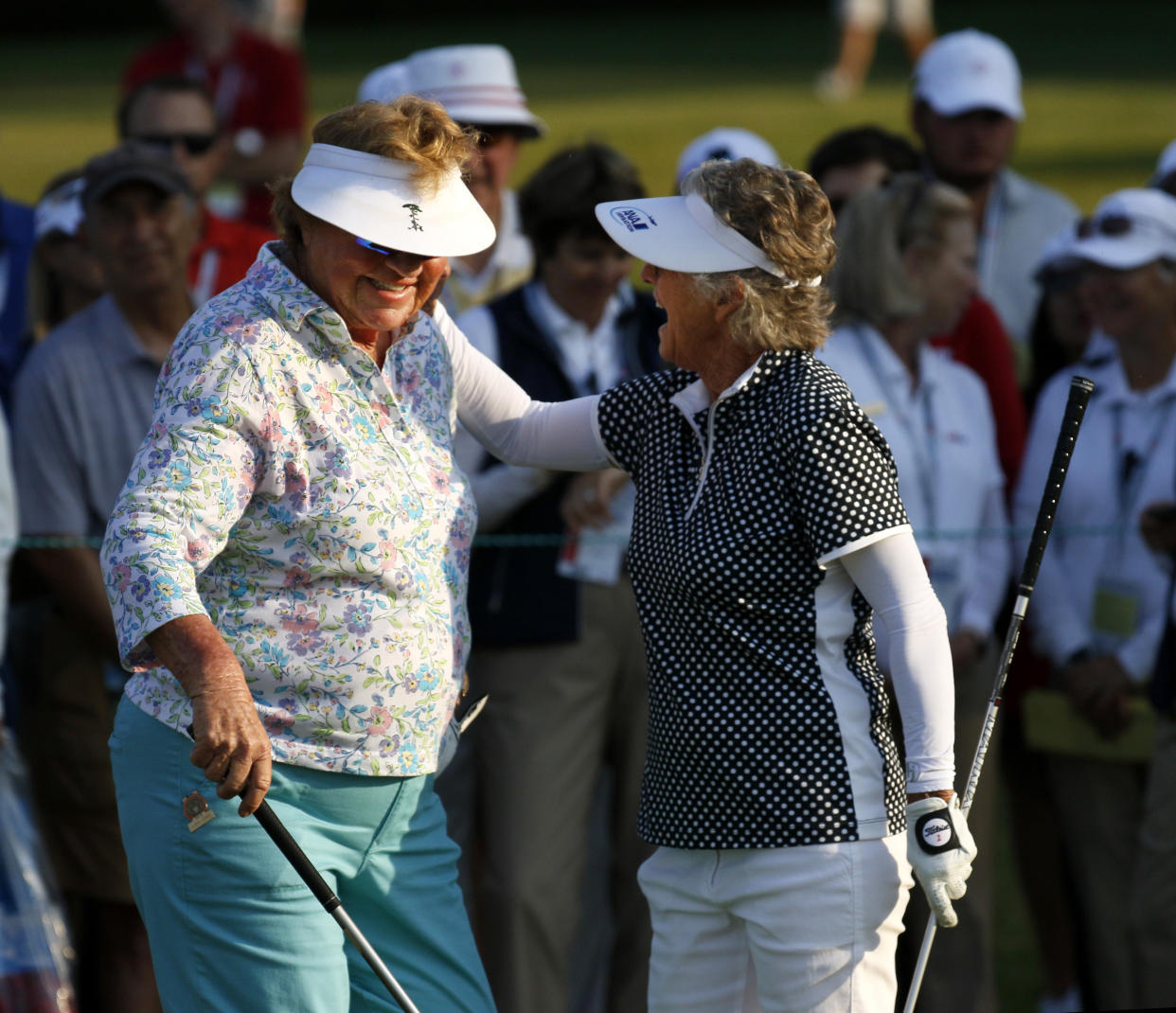 LPGA icon JoAnne Carner, left, shot her age, 79, at the inaugural U.S. Senior Women’s Open in Chicago on Thursday, and sits just nine shots off the lead. (Daniel White/Daily Herald via AP)