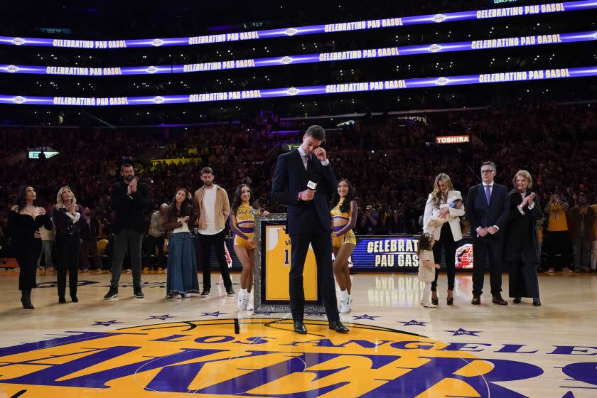 Former Los Angeles Lakers forward Pau Gasol wipes his tears while speaking at his jersey retirement ceremony during halftime of the team's NBA basketball game against the Memphis GrizzliesTuesday, March 7, 2023, in Los Angeles. (AP Photo/Jae C. Hong)