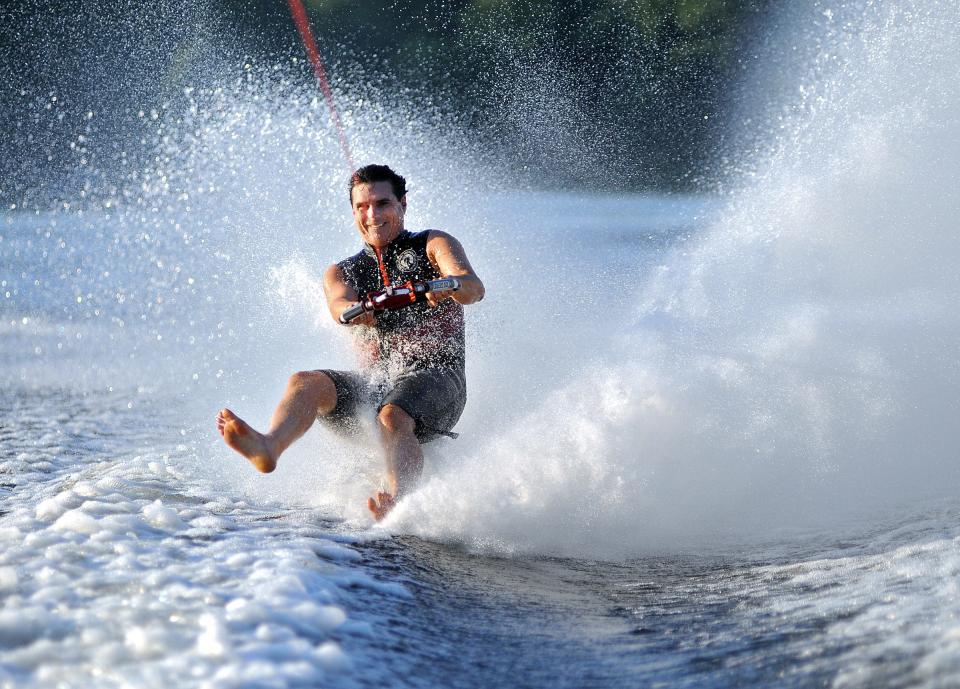 Seen here when he was still in his 50s, Kevin Keith of Southbridge performs a one-footed, slalom stunt as he is towed at a speed of 46 mph across Buffumville Lake in Charlton. Last month, Keith, now 66, won three gold medals in the International Waterski & Wakeboard Federation Senior Masters Barefoot Tournament in San Marcos, Texas.