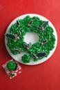 <p>This pretty-as-a-picture dessert uses lots of individual treats, like cupcakes and cut-out cookies, to create one temptingly sweet holiday masterpiece.</p><p><a href="https://www.womansday.com/food-recipes/food-drinks/recipes/a14732/cupcake-wreath-recipe-wdy1213/" rel="nofollow noopener" target="_blank" data-ylk="slk:Get the Cupcake Wreath recipe.;elm:context_link;itc:0;sec:content-canvas" class="link "><em><strong>Get the Cupcake Wreath recipe.</strong></em></a> </p>