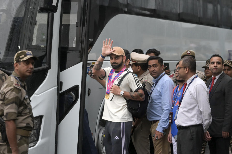 India's Virat Kohli greets fans as he arrives at the Indira Gandhi International Airport in New Delhi, India, Thursday, July 4, 2024. Indian cricket team returned Thursday after winning the T20 Cricket World Cup hosted by the United States and the West Indies. (AP Photo)