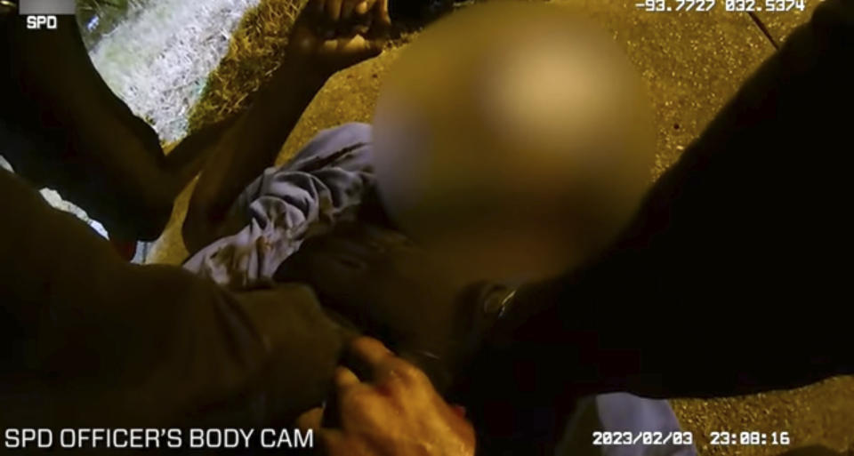 This photo provided by Louisiana State Police shows police body cam video of police administering aid to Alonzo Bagley after police shot Bagley after a foot chase on Feb. 3, 2023 in Shreveport, La. A white Louisiana police officer was arrested Thursday, Feb. 16, for fatally shooting Bagley, an unarmed Black man who was trying to flee police responding to a domestic disturbance. Shreveport Police Officer Alexander Tyler is charged with negligent homicide. (Louisiana State Police via AP)