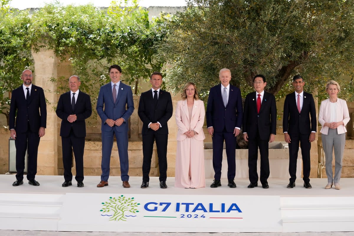 From left, European Council president Charles Michel, Olaf Scholz, Justin Trudeau, Emmanuel Macron, Giorgia Meloni, Joe Biden, Fumio Kishida, Rishi Sunak and European Commission president Ursula von der Leyen (AP)