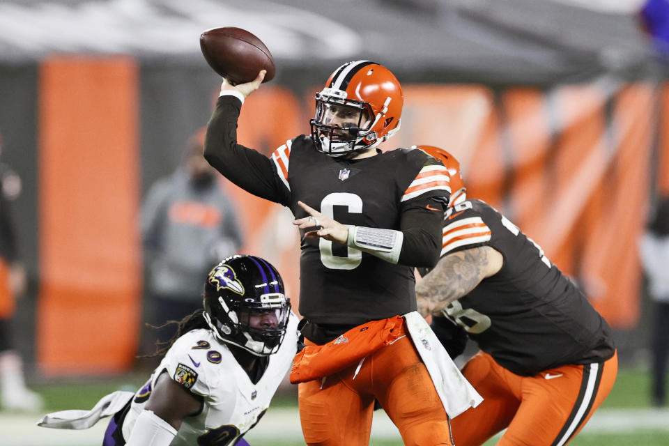 Cleveland Browns quarterback Baker Mayfield (6) throws a 21-yard touchdown pass to wide receiver Rashard Higgins during the second half of an NFL football game against the Baltimore Ravens, Monday, Dec. 14, 2020, in Cleveland. (AP Photo/Ron Schwane)