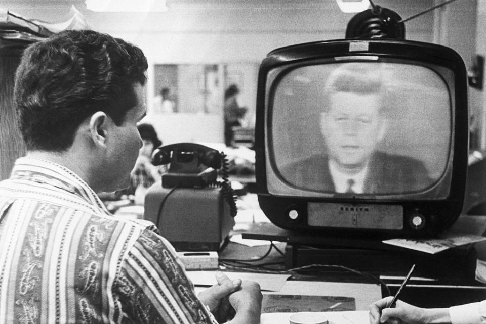 Someone watching John F. Kennedy on the television set