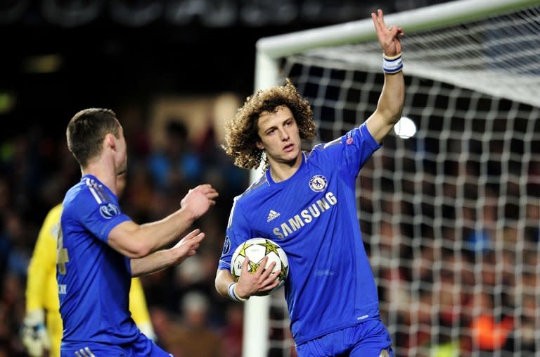 Chelsea's Brazilian defender David Luiz (R) celebrates scoring a penalty in the UEFA Champions League match against FC Nordsjaelland on December 5. The Blues routed Nordsjaelland 6-1 to secure a first victory under interim manager Rafael Benitez, but it wasn't enough to book a place in the last 16 as Chelsea became the first European champions to bow out at the group stage