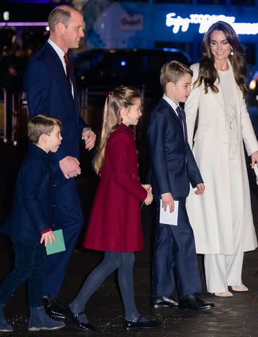 <p>Samir Hussein/WireImage</p> Prince Louis, Prince William, Princess Charlotte, Prince George and Kate Middleton attend a Christmas concert on December 8, 2023