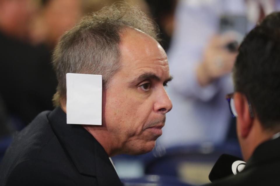 An Arizona delegate wears a fake bandage on his ear during the second day of the Republican National Convention at the Fiserv Forum. The second day of the RNC focused on crime and border policies.
