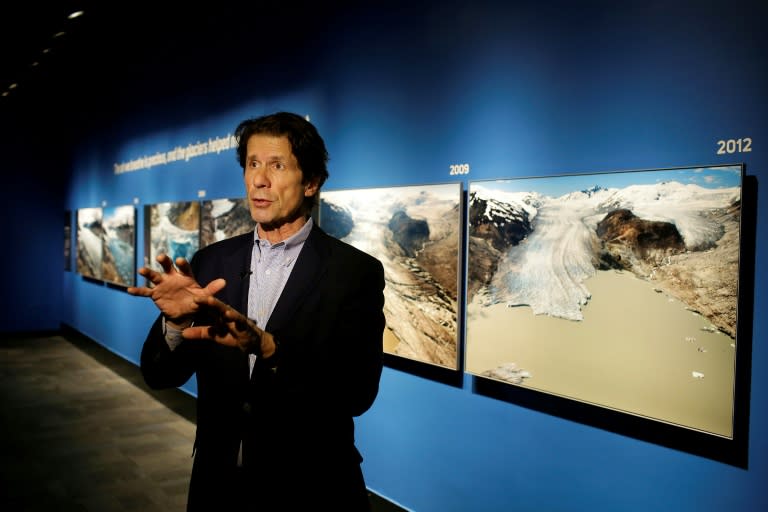 US photographer James Balog speaks about his images at the "Extreme Ice" exhibit at the Museum of Science and Industry in Chicago, Illinois