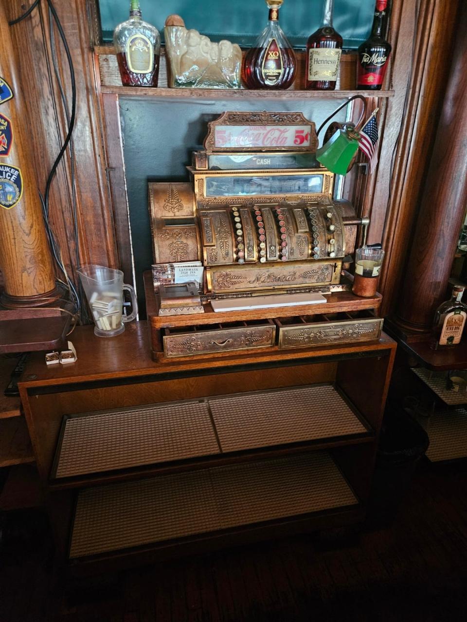 An early-1900's era cash register is displayed at Landmark 1850 Inn, where it was previously used.