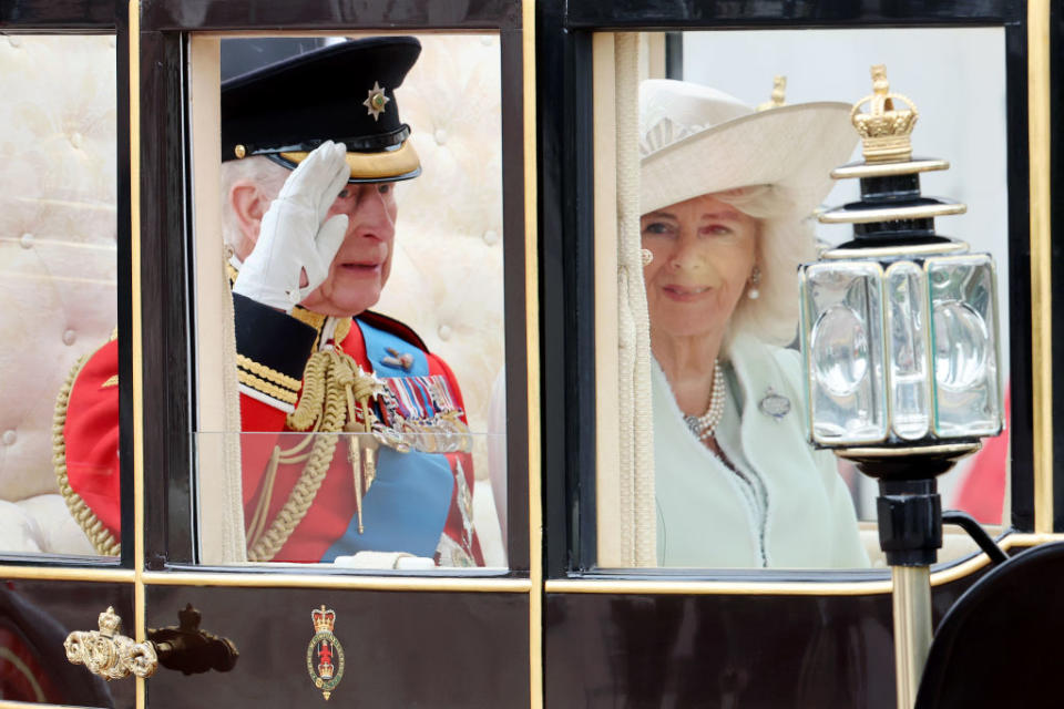 King Charles III saluted the troops as he arrived in a horse-drawn carriage alongside his wife, Queen Camilla.<span class="copyright">Chris Jackson—Getty Images</span>