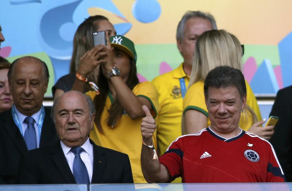 FIFA President Sepp Blatter (L) and Colombia President Juan Manuel Santos watch the 2014 World Cup quarter-finals between Brazil and Colombia at the Castelao arena in Fortaleza July 4, 2014. REUTERS/Jorge Silva