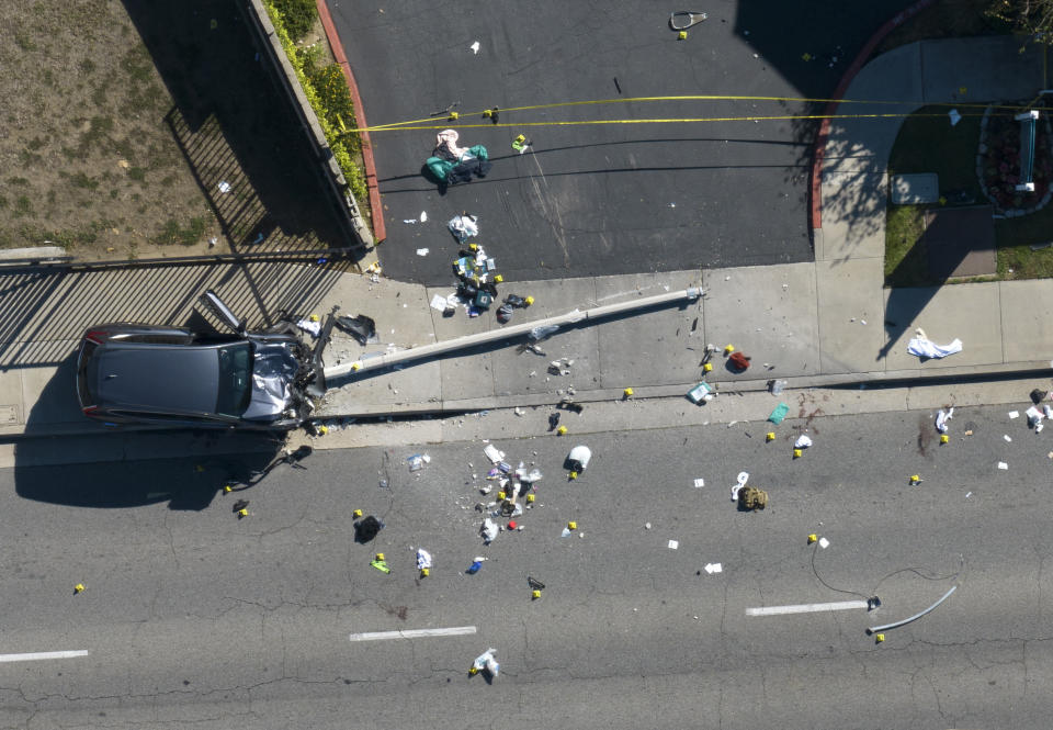 Investigators work the scene where 25 Los Angeles County sheriff’s academy recruits on a training run were hit by a vehicle that veered onto the wrong side of the road on Wednesday, Nov. 16, 2022, in Whittier, Calif. (Jeff Gritchen/The Orange County Register via AP)