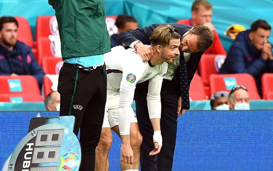 Gareth Southgate passes on last-minute instructions to Jack Grealish - SHUTTERSTOCK