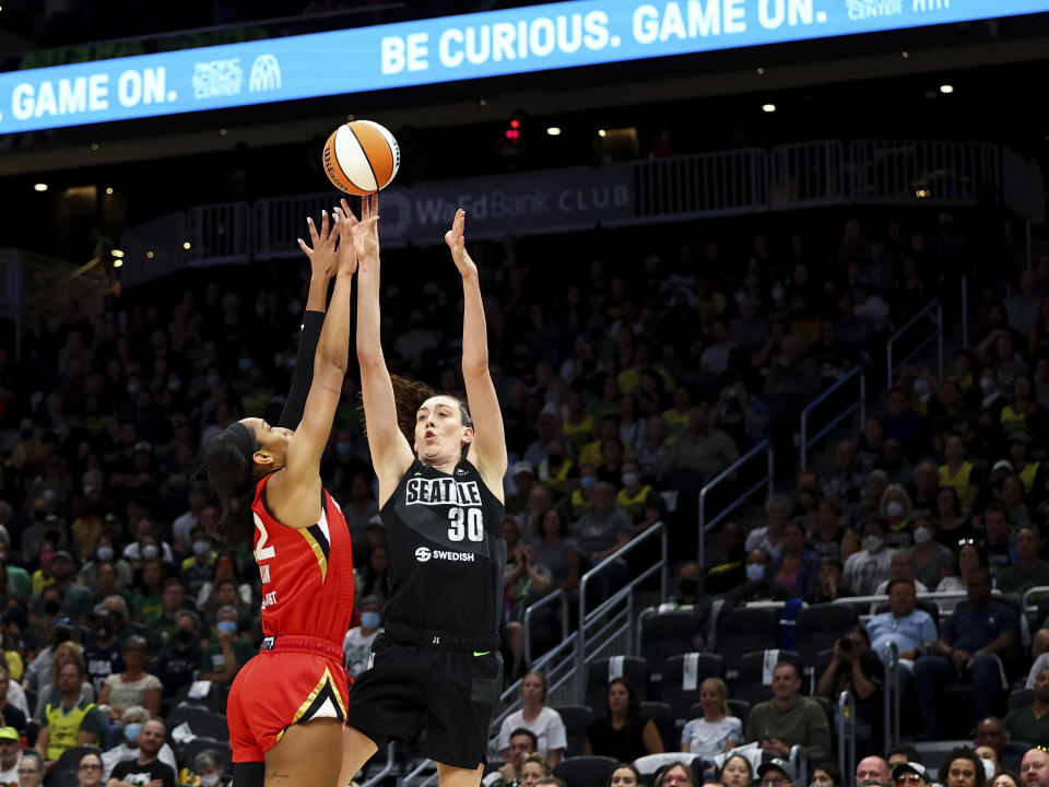 Seattle Storm forward Breanna Stewart (30) shoots over Las Vegas Aces forward A'ja Wilson (22) during the first half of Game 4 of a WNBA basketball playoff semifinal Tuesday, Sept. 6, 2022, in Seattle. The Aces beat the Storm 97-92 to advance to the WNBA Finals. (AP Photo/Lindsey Wasson)