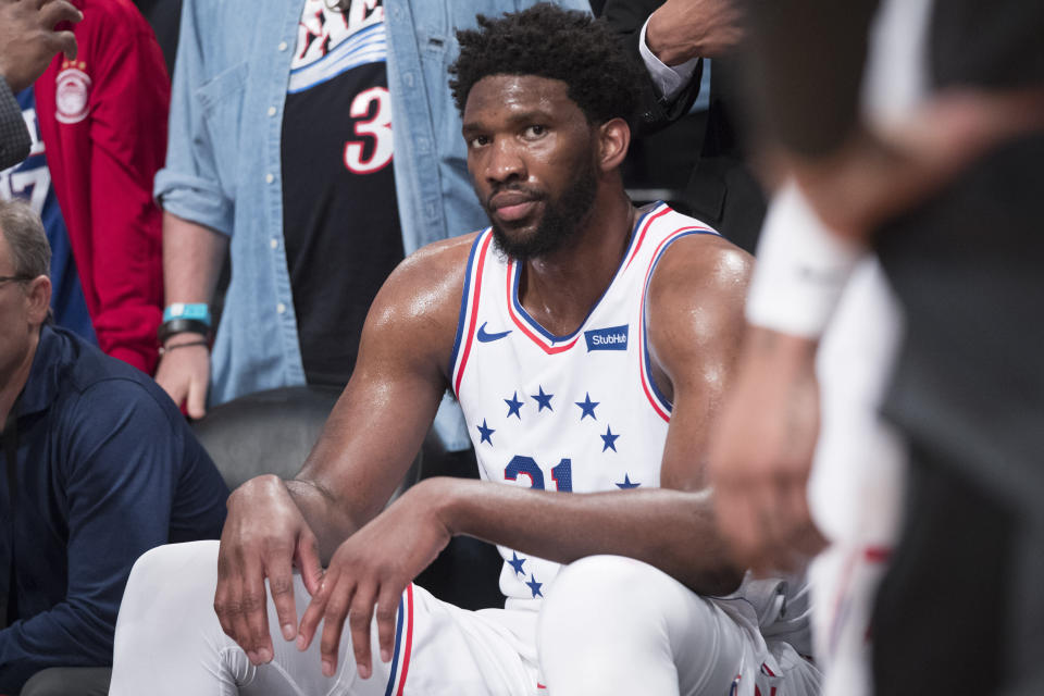 Philadelphia 76ers center Joel Embiid (21) reacts from the bench after a shoving match during the second half of Game 4 of a first-round NBA basketball playoff series against the Brooklyn Nets, Saturday, April 20, 2019, in New York. The 76ers won 112-108. (AP Photo/Mary Altaffer)