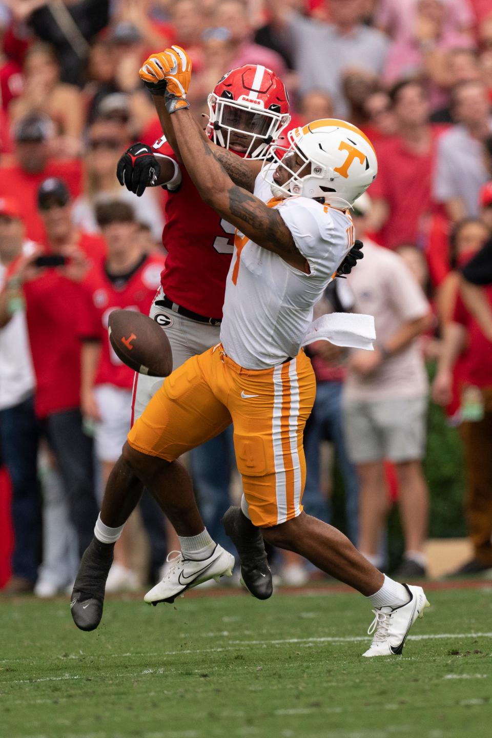 Georgia defensive back Jaheim Singletary (9) breaks up a pass intended for Tennessee wide receiver Cedric Tillman (4) during the first half of an NCAA college football game Saturday, Nov. 5, 2022 in Athens, Ga. (AP Photo/John Bazemore)