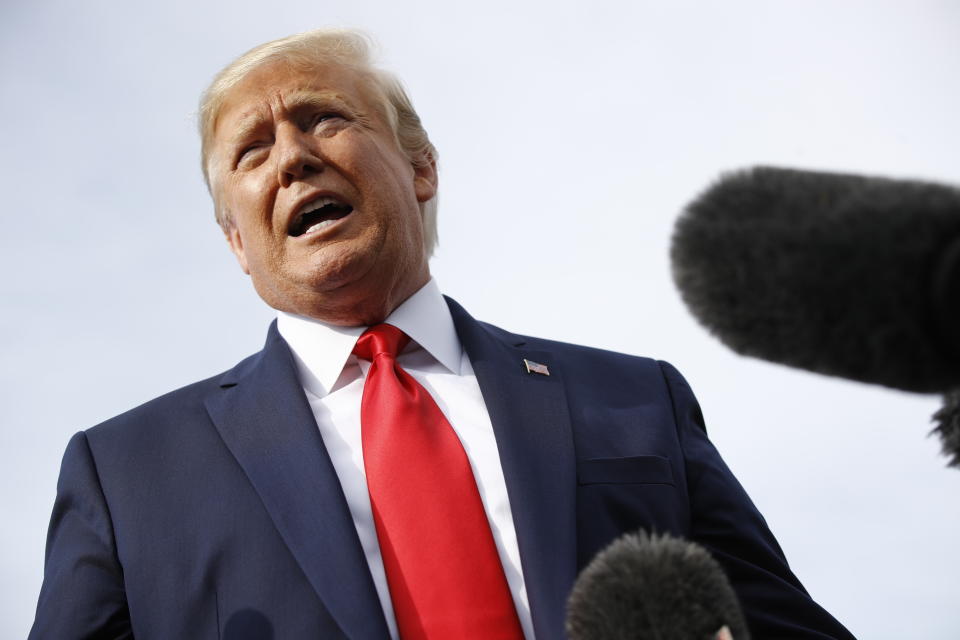 President Donald Trump speaks with reporters before boarding Air Force One at Morristown Municipal Airport in Morristown, N.J., Thursday, Aug. 15, 2019, en route to a campaign rally in Manchester, N.H. (AP Photo/Patrick Semansky)