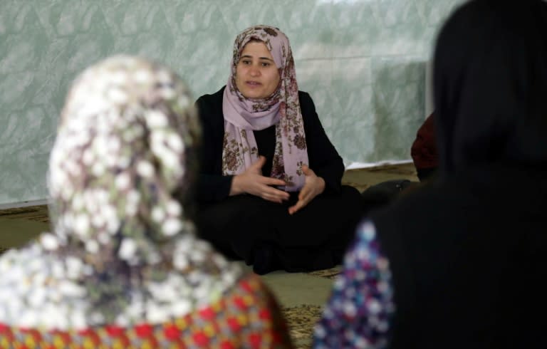 Iraqi Kurdish anti-FGM activist Rasul speaks to women and young girls about the harms of genital mutilation in the village of Sharboty Saghira on December 3, 2018