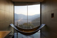 <p>This design-centric hotel features its own vineyard, original contemporary art, and one of the most unique baths we’ve ever seen. </p><p>(Photo: Vina Vik)</p>